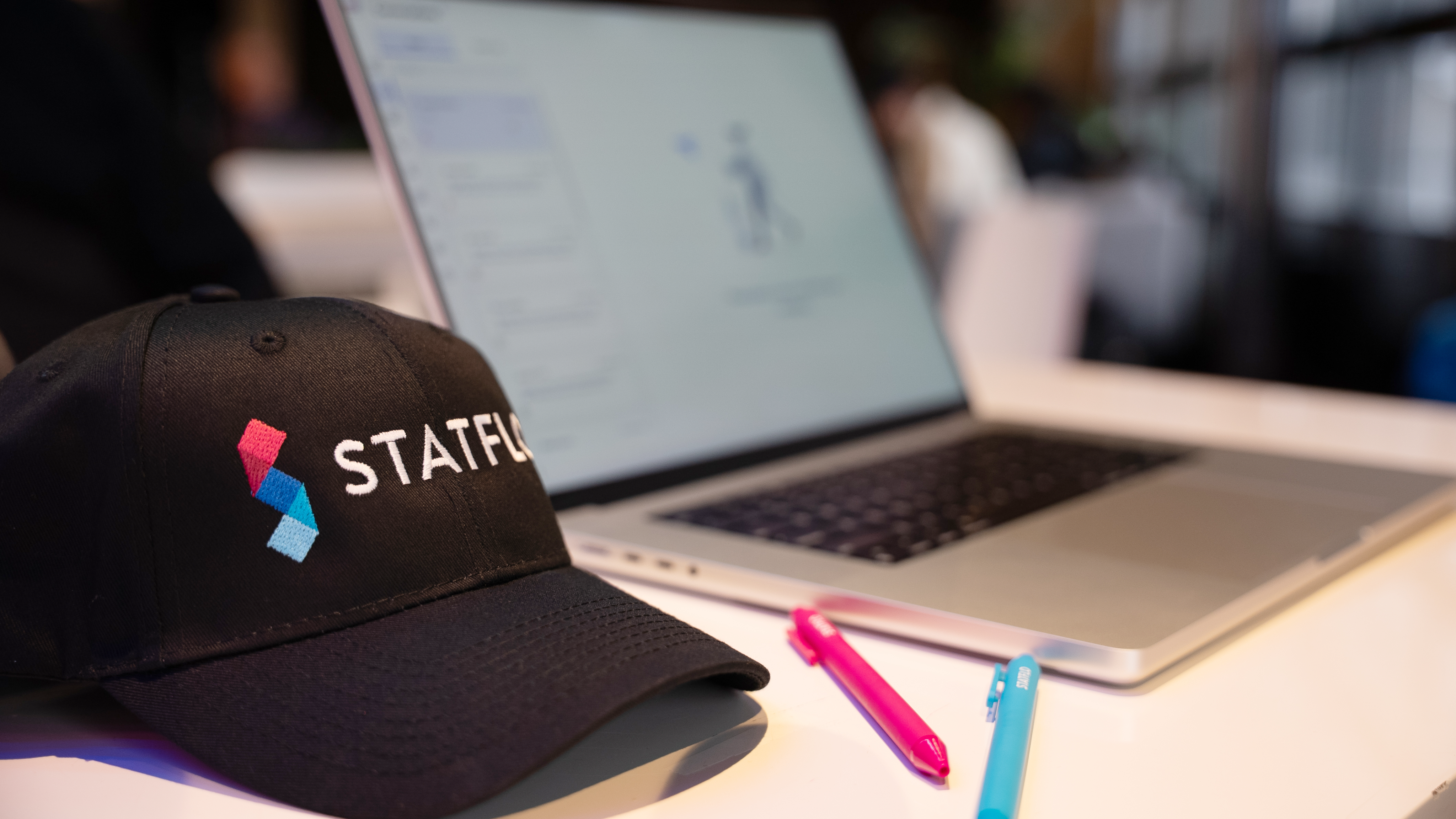 Person at standing desk working on laptop