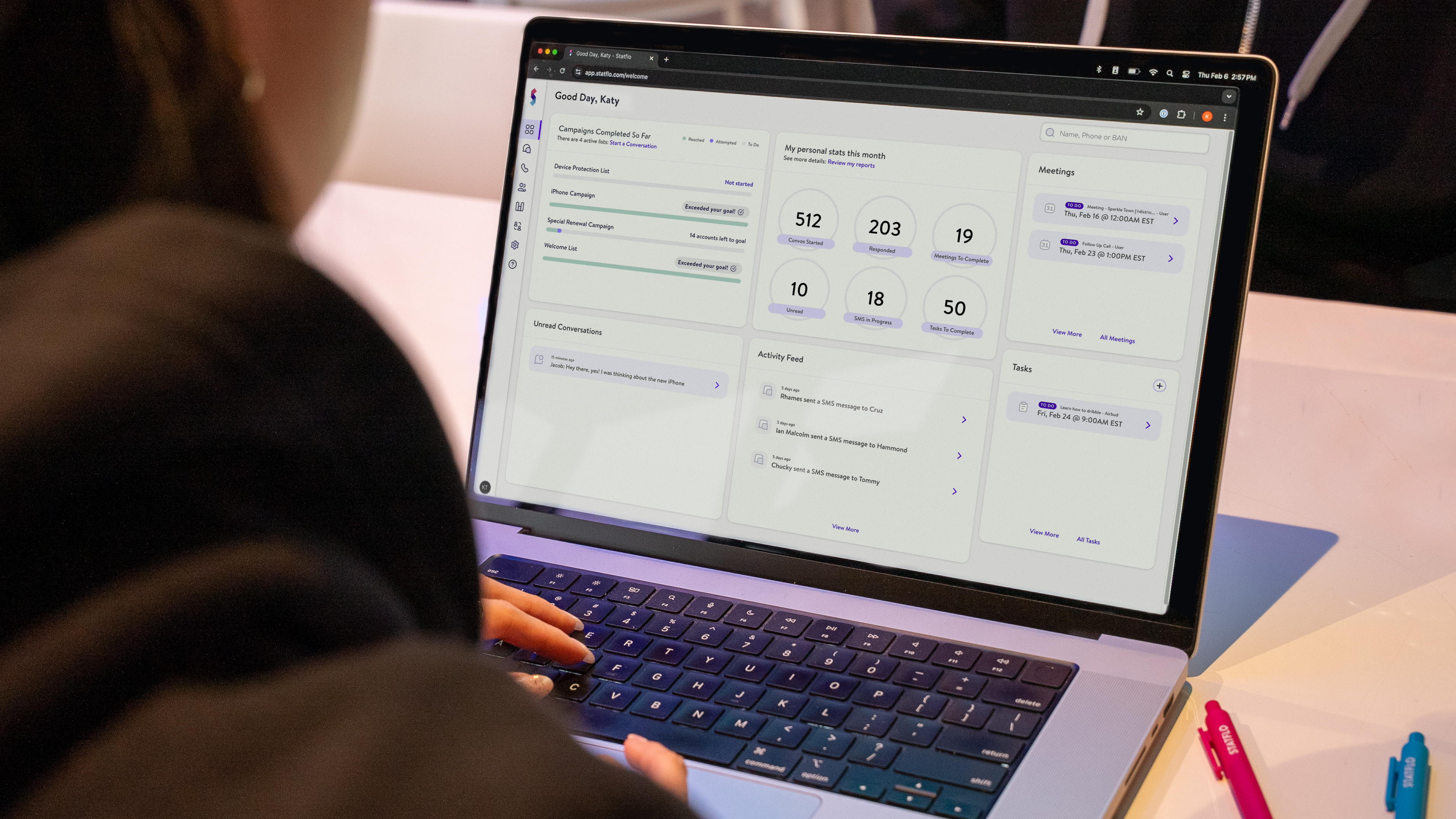 Person sitting on floor working on laptop