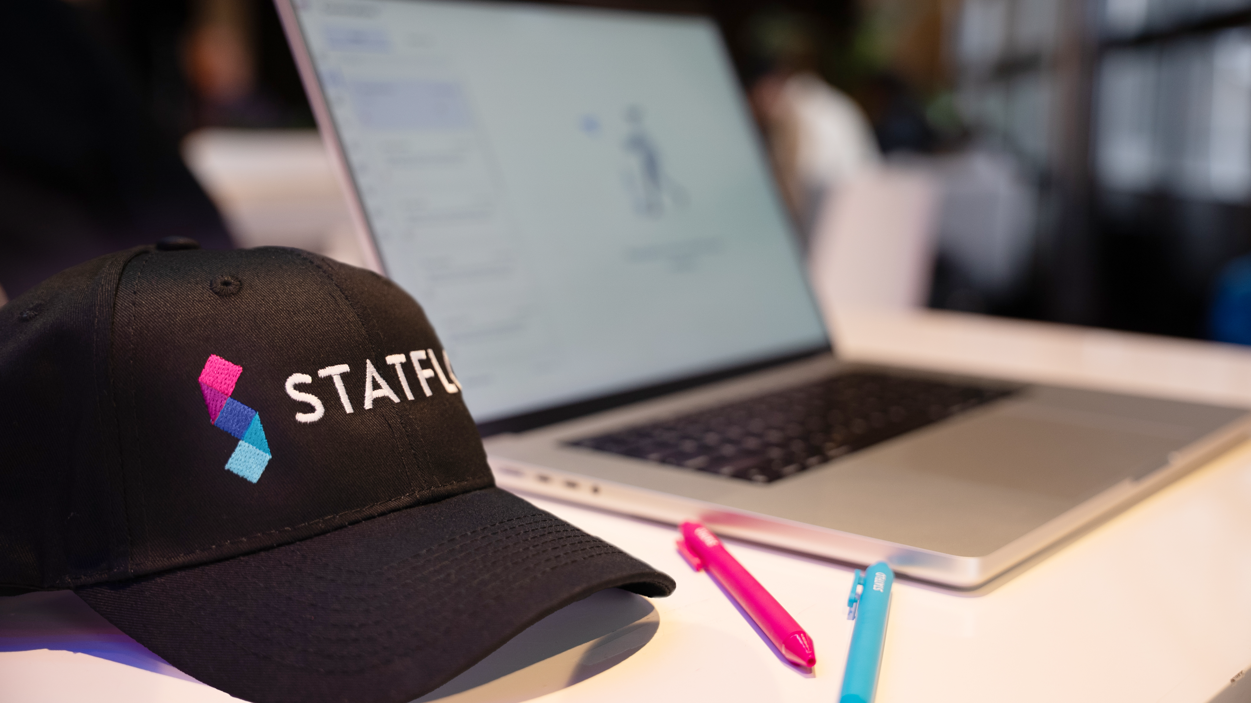 Person at standing desk working on laptop