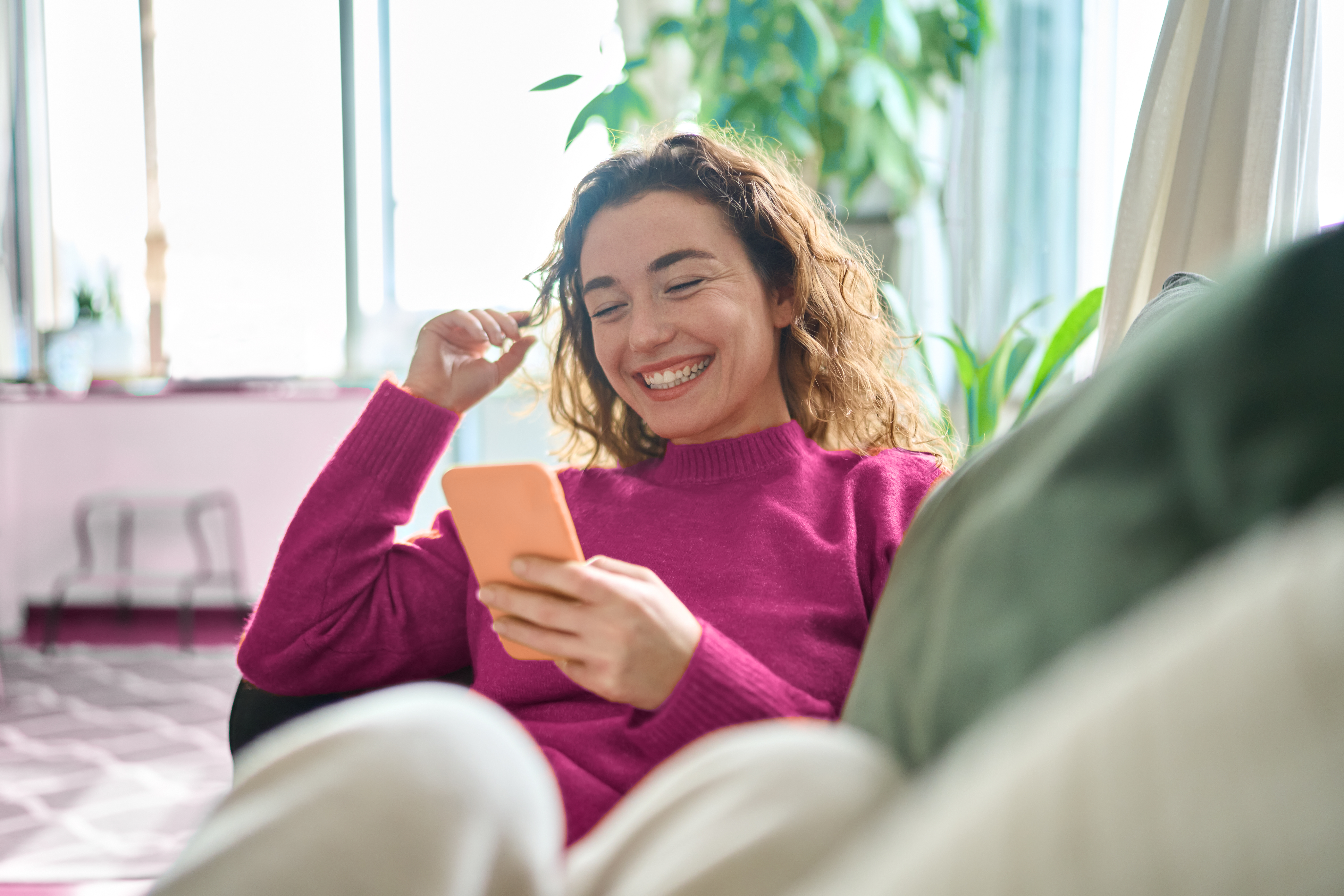 Person sitting on floor working on laptop
