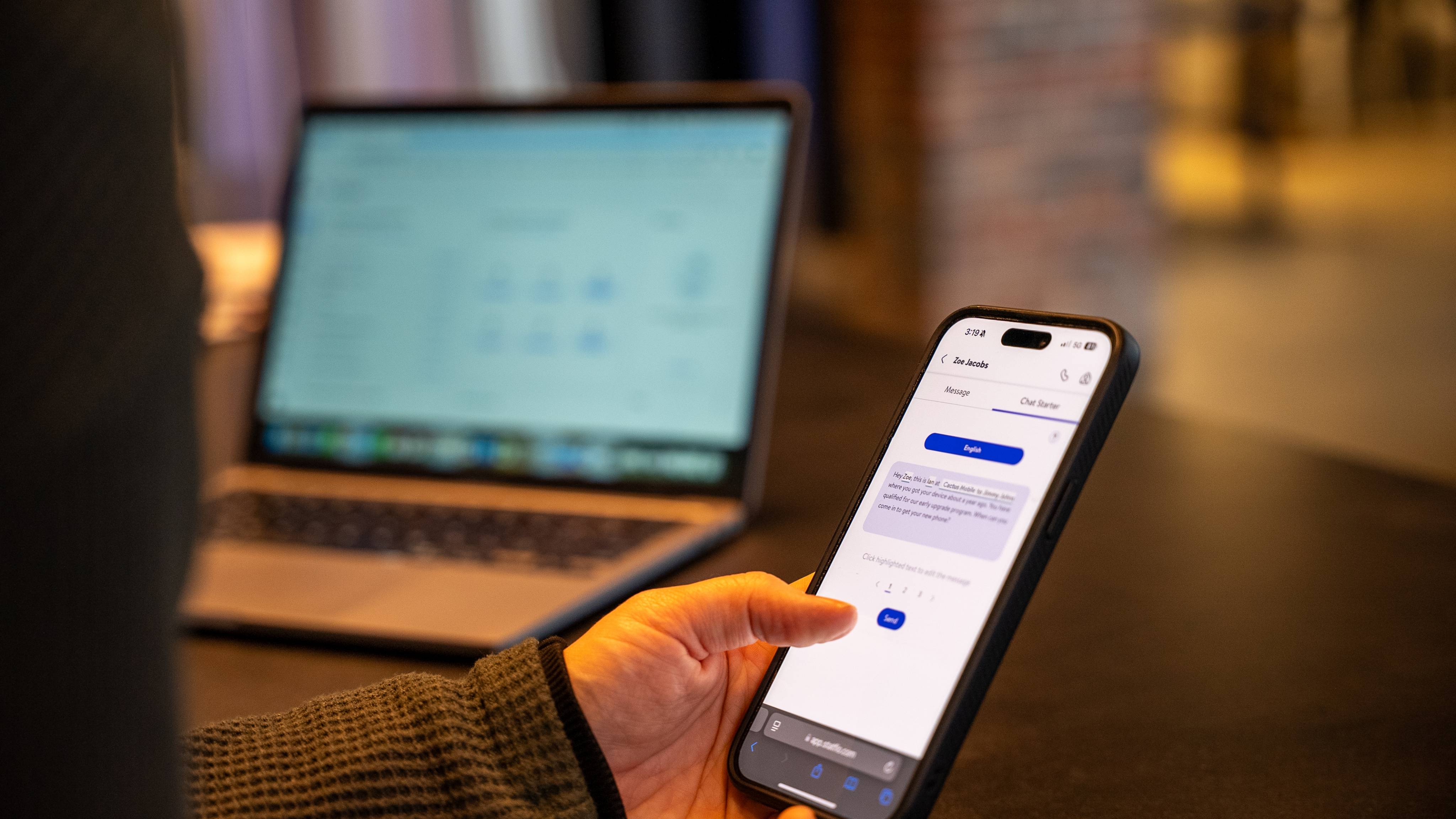 Person sitting on couch working on laptop